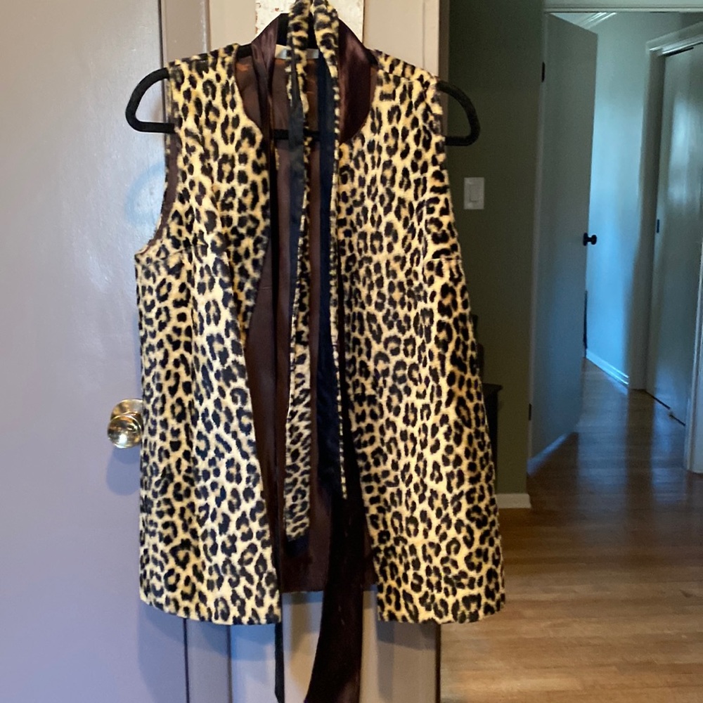 Vintage leopard print vest with two different belts around waste. Small/Med